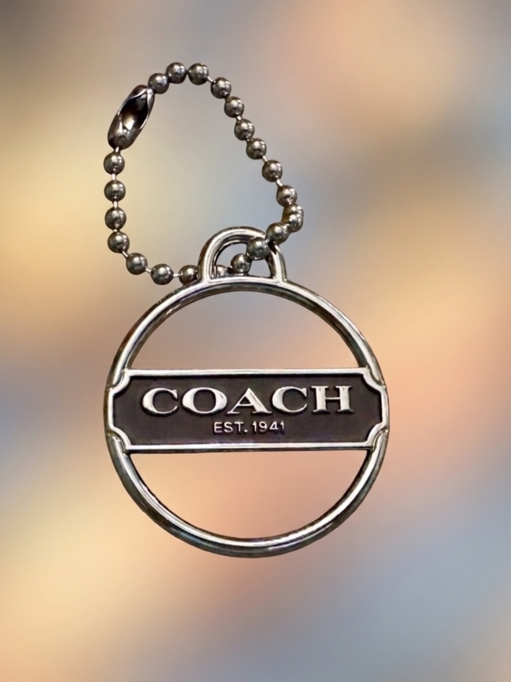 Coach est. 1941  Silver-Tone Round Logo Tag with Black Enamel Panel 2494